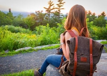 Single traveler on a backpacking trip in the woods. Photo by Kristin Hardwick. Stocksnap.