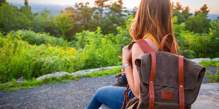 Single traveler on a backpacking trip in the woods. Photo by Kristin Hardwick. Stocksnap.