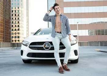 male fashion designers. Male fashion model in front of a Mercedes Benz