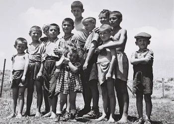 A group of orphans, survivors of the Holocaust, at the reception camp in Atlit, 14th July 1944. Photo by Government Press Office. Flickr.
