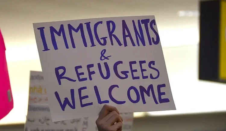 Immigrants & Refugees Welcome. Photo by Adam Fagen. Flickr.