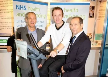 Dean Royles and Jan Sobieraj at NHS health and wellbeing stand. Photo by NHSE. Flickr.