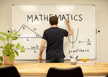 National Academy of Mathematical Sciences. Maths Teacher on the white board. Photo by Preply Images. Flickr.