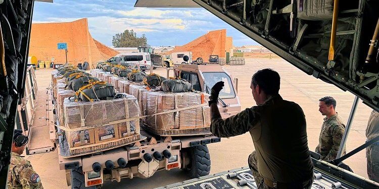 Air Force loadmasters prepare to load Jordanian-provided humanitarian aid destined for Gaza into an Air Forces HC-130J Combat King II. Photo by 1st Lt. Kaitlyn Lawton. DoD.
