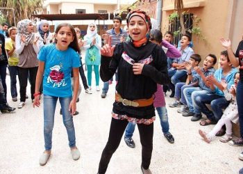 Dancing and singing to forget the pain of Syria's conflict. Photo by DFID. Flickr.