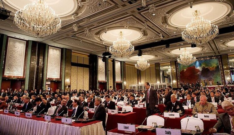 Delegates sit during the opening plenary session where Secretary of Defense Chuck Hagel speaks at the Shangri-La Dialogue in Singapore. Photo by Secretary of Defense. Wikimedia.