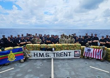The Crew of HMS Trent with their latest $500M drugs bust. Photo by Royal Navy. MOD.