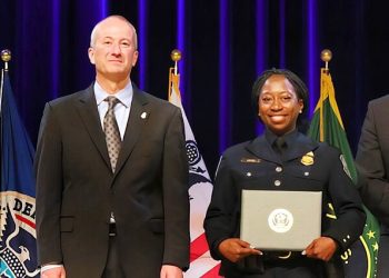 Troy A. Miller presented the Commissioner's Award for Resiliency to Tahira Manns during a ceremony in Washington, D.C., in April. Photo by the CBP.