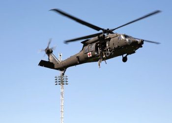 Members of the U.S. Army practice search and rescue techniques in a UH-60 Blackhawk helicopter. Photo by Cathryn Lindsay. Airforce, DOD.