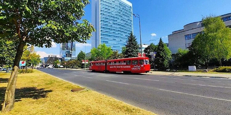 A red tram on the streets in Sarajevo, promoting GREAT film collaborations during the 30th Sarajevo Film Festival. Photo by British Embassy Sarajevo. Gov.uk.