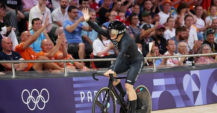 Ellesse Andrews of New Zealand takes a lap of honour after winning gold. Photo by Getty Images.
