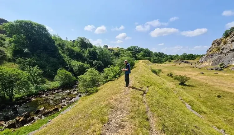 An Environment Agency Officer surveys the River Sprint. Photo by the Environment Agency.