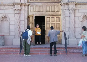 Joan Confronted by Homeless People. Photo by Tony Fischer Photography.