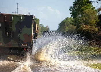 Military vehicles cause wake and waves while assisting law enforcement as part of their route clearing patrol in response to Hurricane Helene in Cedar Key, Fla., Sept. 27, 2024. Photo by DOD.