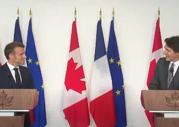 Trudeau and Micron at a press conference. Photo by the Canadian Government.