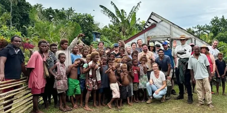 A group photo with community members at one of the visited cocoa farming communities on Guadalcanal, Solomon Islands. Photo by the British High Commission Honiara.