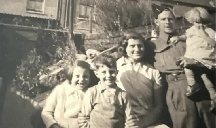 Cpl John Alfred Owens with his wife and children. Photo provided by his family.