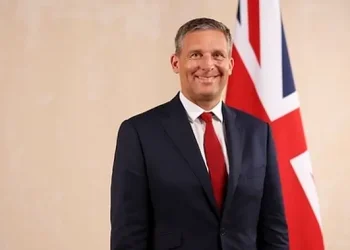 Official portrait of Lord Timpson - Minister of State. Photo by the UK Government.
