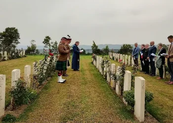 Padre David Anderson leads the service for Pte George Ewan at Bolsena War Cemetery. Photo by the MOD.