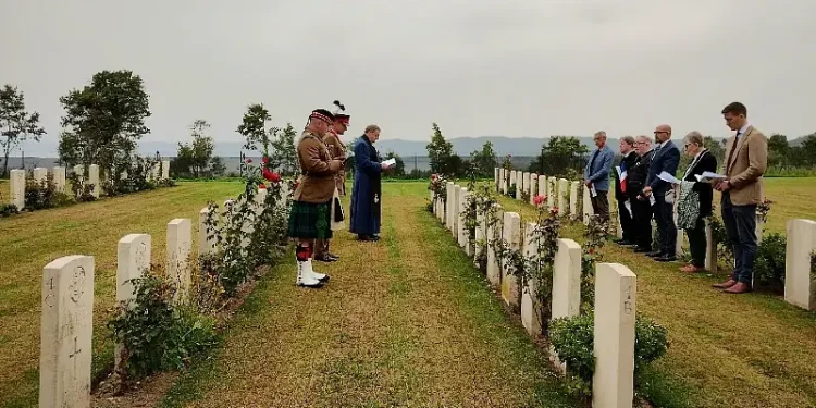 Padre David Anderson leads the service for Pte George Ewan at Bolsena War Cemetery. Photo by the MOD.