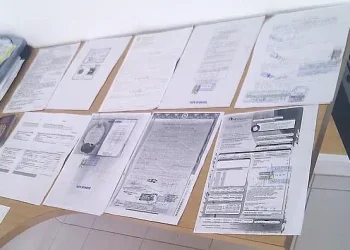 Stack of forms for my visa. Photo by Mark Hillary.