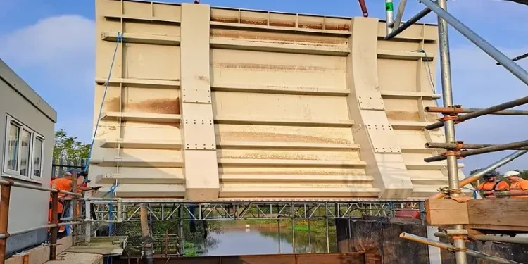 The first of three new gates being installed at the Leigh flood storage area, which will soon hold 25 per cent more water back from communities. Photo by the Environment Agency.