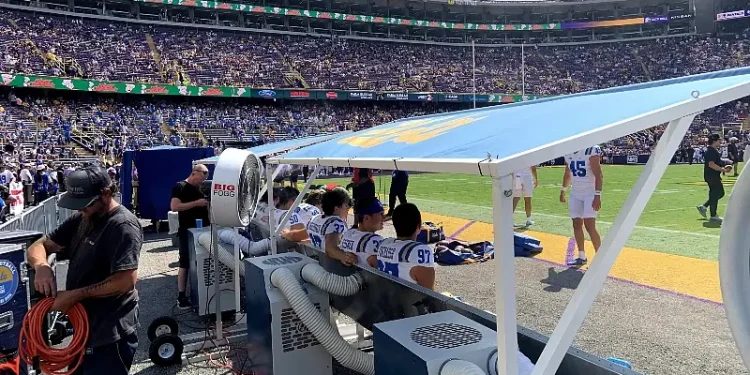 UCLA's sideline with Big Fogg cooling benches, misting fans, and shade structures. Photo by Big Fogg Inc.