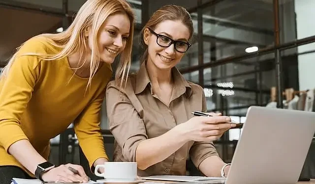 Women working in an office. Photo by Pixabay.