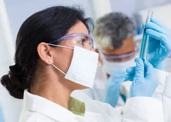 Young lady doing Lab testing. Photo by iStock.