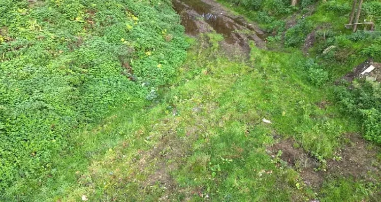 Extreme care needed to remove the household and builders waste without further damage. Photo by the Environment Agency.