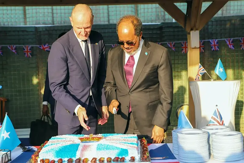 Kings Birthday. Cutting the cake. Photo by The British Government.
