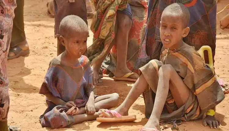 Malnourished children, weakened by hunger. Photo by DFID - UK Department for International Development.