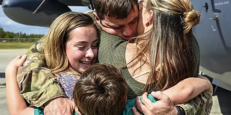 Military Family reunited. Military childcare costs. Photo by Trump White House Archive.