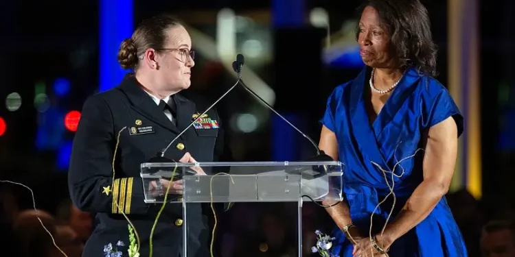 Navy Cmdr. LeAndra Kissinger, commanding officer of the USS Beloit, left, and retired Army Maj. Gen. Marcia M. Anderson give a speech at the USS Beloit chairman's reception in Milwaukee. Photo by Hersom.