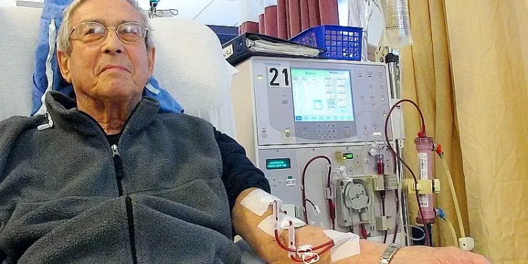 Older patient receiving dialysis. Photo by Anna Frodesiak.