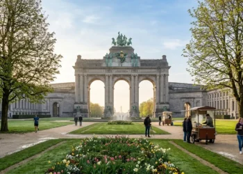 AI-generated photograph-style image of Brussels’ Parc du Cinquantenaire with its triumphal arch, spring flowers and waffle vendors.
