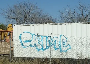 Crime written on a container. Photo by Tim Patterson.