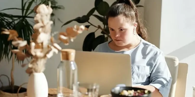 Young lady studying at her computer. Photo supplied by Ofsted.