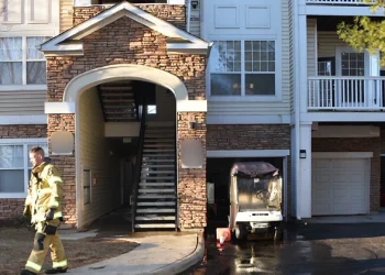 Ashburn Multi-family Dwelling with fireman leaving. Photo by Loudoun County.