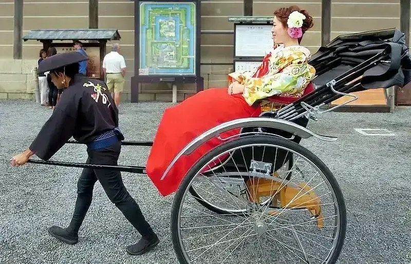 Kyoto travel on a Rickshaw. Photo by David Stanley.