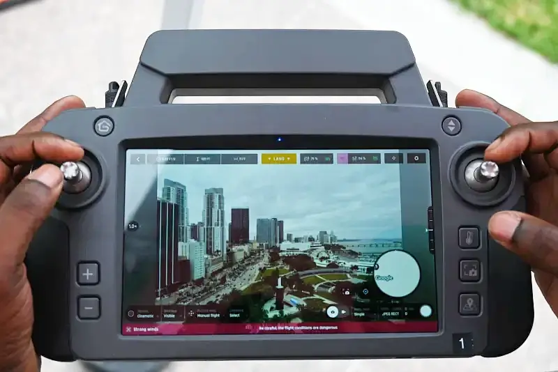 A first responder uses a ground control station from a Parrott ANAFI USA GOV drone to observe Bayfront Park while conducting a flyover. Photo by NUSTL.