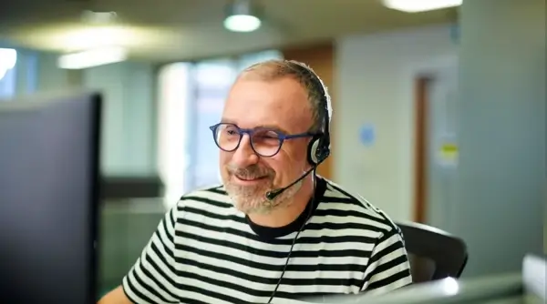 Call handler in action. Photo by HM Courts, Tribunals Service and Getty Images.