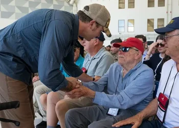 Defense Secretary Pete Hegseth shakes hands with a World War II veteran attending a ceremony at Andersen Air Force Base, Guam, March 27, 2025. Photo by Air Force M Keech.
