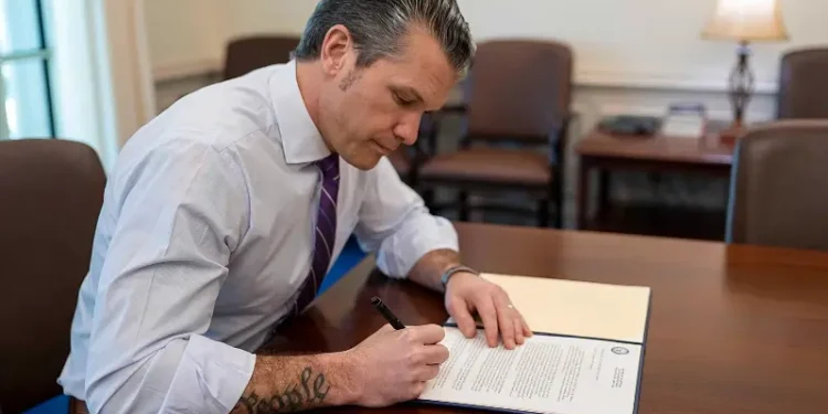 Defense Secretary Pete Hegseth signs a memorandum to rename Fort Moore, Ga. to Fort Benning at the Pentagon, March 3, 2025. Photo by NPO Kubitza.