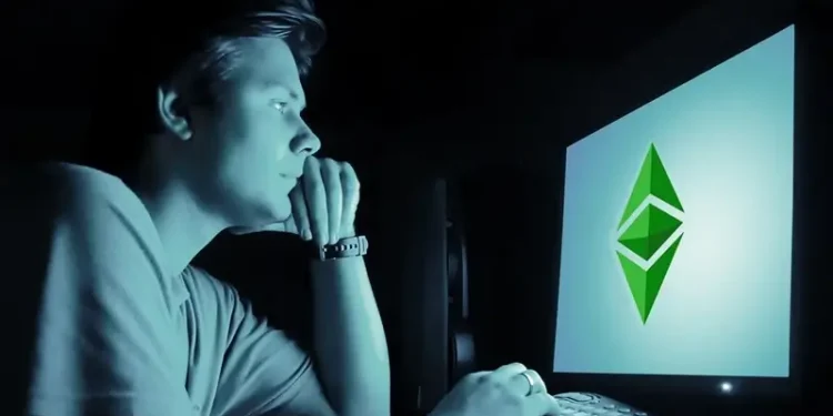 Man looking at a computer screen. The Darknet. Photo by EthereumClassic.