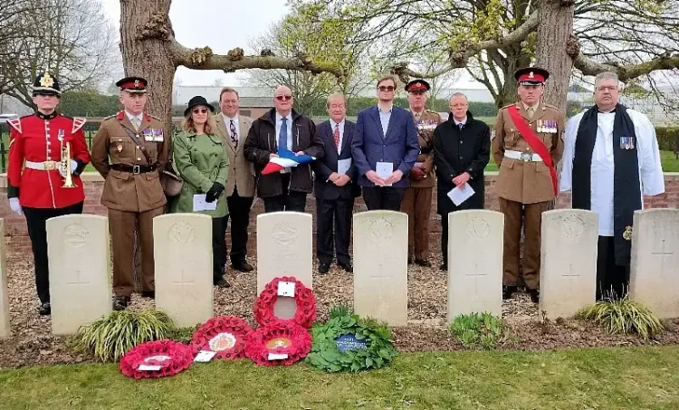 Members of the Smith family stand at the graveside with the military party. Photo by the MOD.