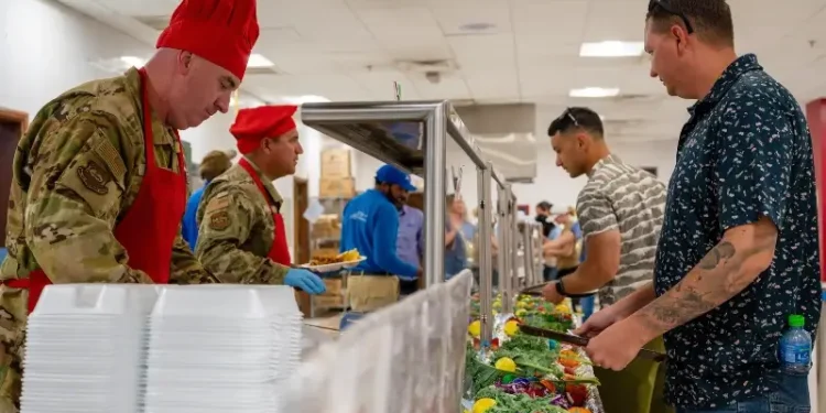 Airmen are served food, called chow, in a dining facility, called a DFAC, in the U.S. Central Command area of responsibility. Photo by AF Tech Sgt. Leddick.