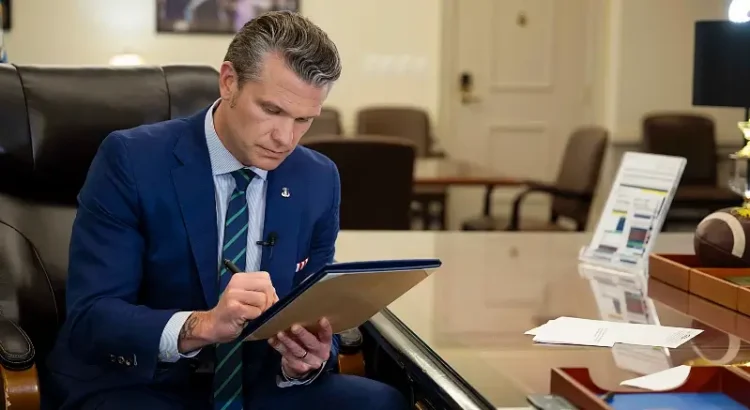Defense Secretary Pete Hegseth signs a memorandum regarding medical waivers at the Pentagon, April 24, 2025. Photo by Air Force, M Keech.