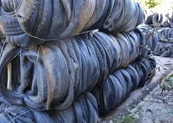 Multiple piles of used tires at a un-registered dump site. Photo by the Environment Agency.