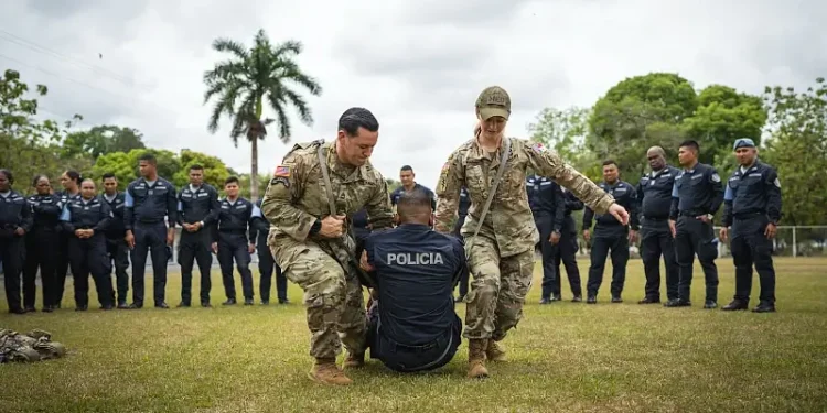 Soldiers assigned to U.S. Special Operations Command South demonstrate a litter-carry technique during a medical training course for the Panamanian National Police near Panama City. Photo by Gen. Wild.